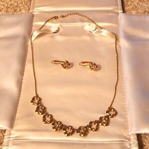 Gold plated necklace with flowers and matching earrings